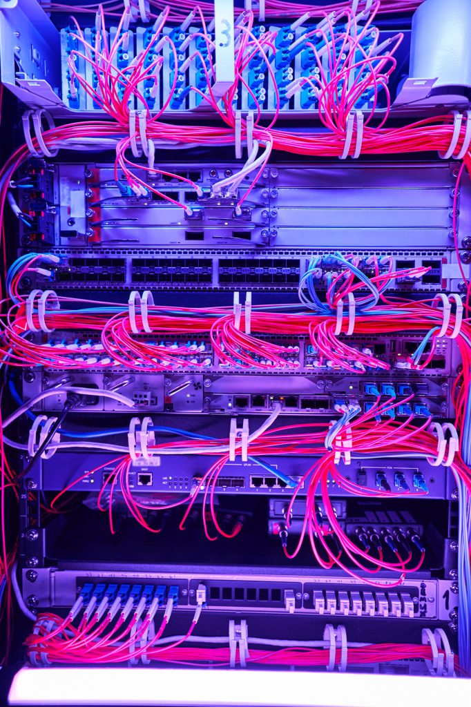 Arrangement of red fiber optic cables in server hardware